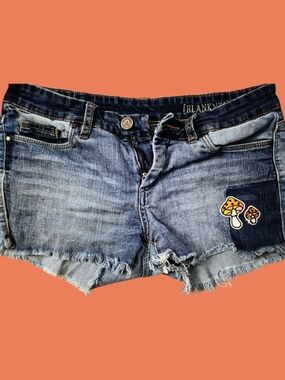 Blank NYC Blue Distressed Denim Cutoff Shorts with Mushroom Patch